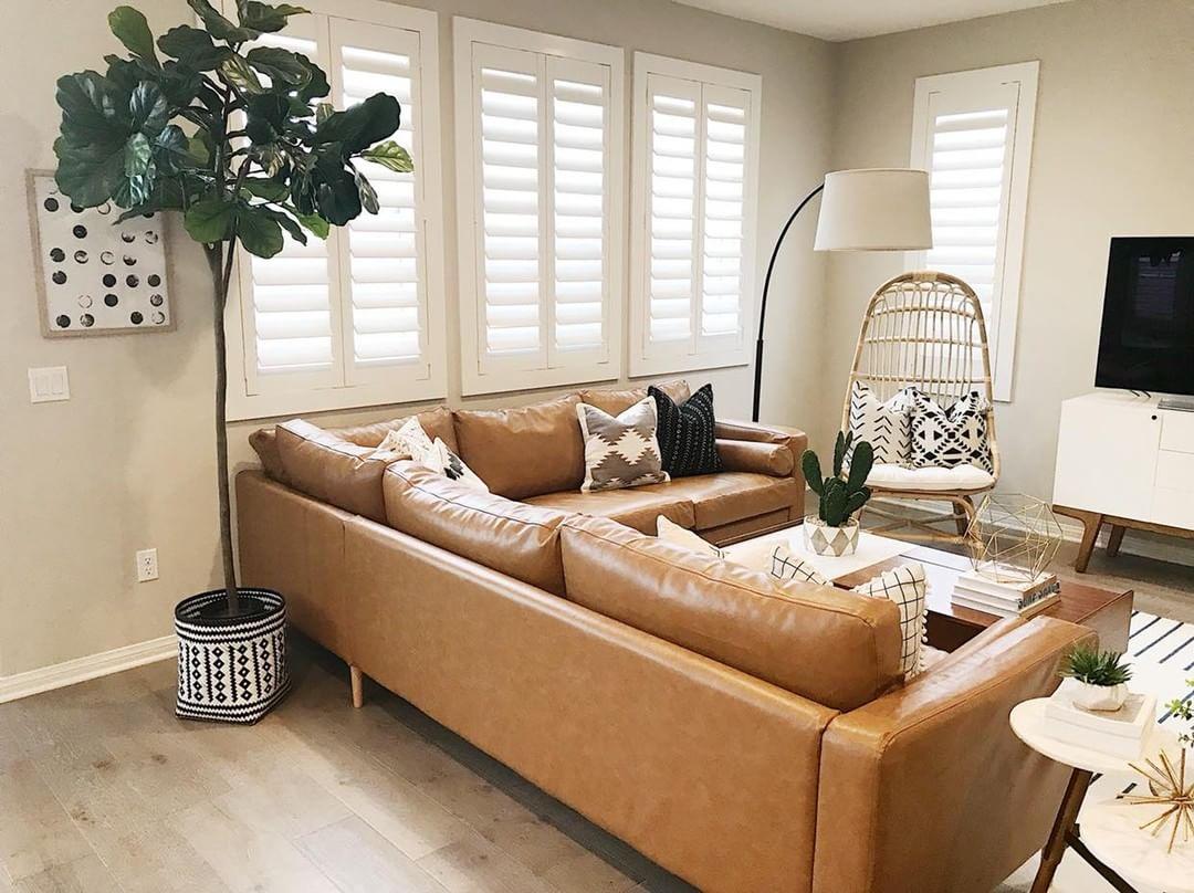 Warm living room with our Polywood shutters in Dallas.